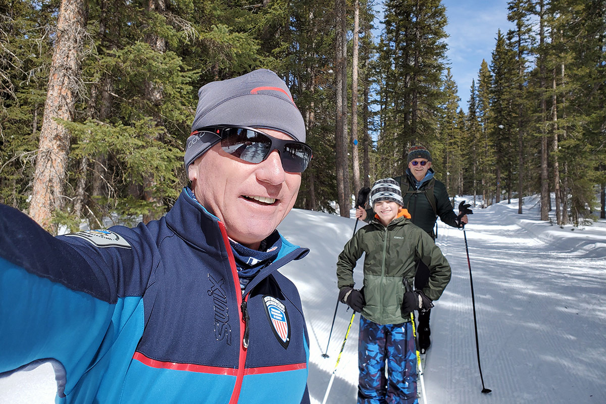 PSIA-certified cross country ski instructor with students during the lesson in western Colorado