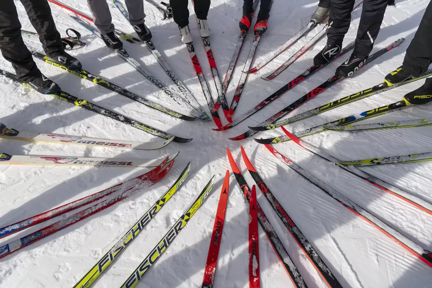Photo of skiers in a ski clinic standing in a circle